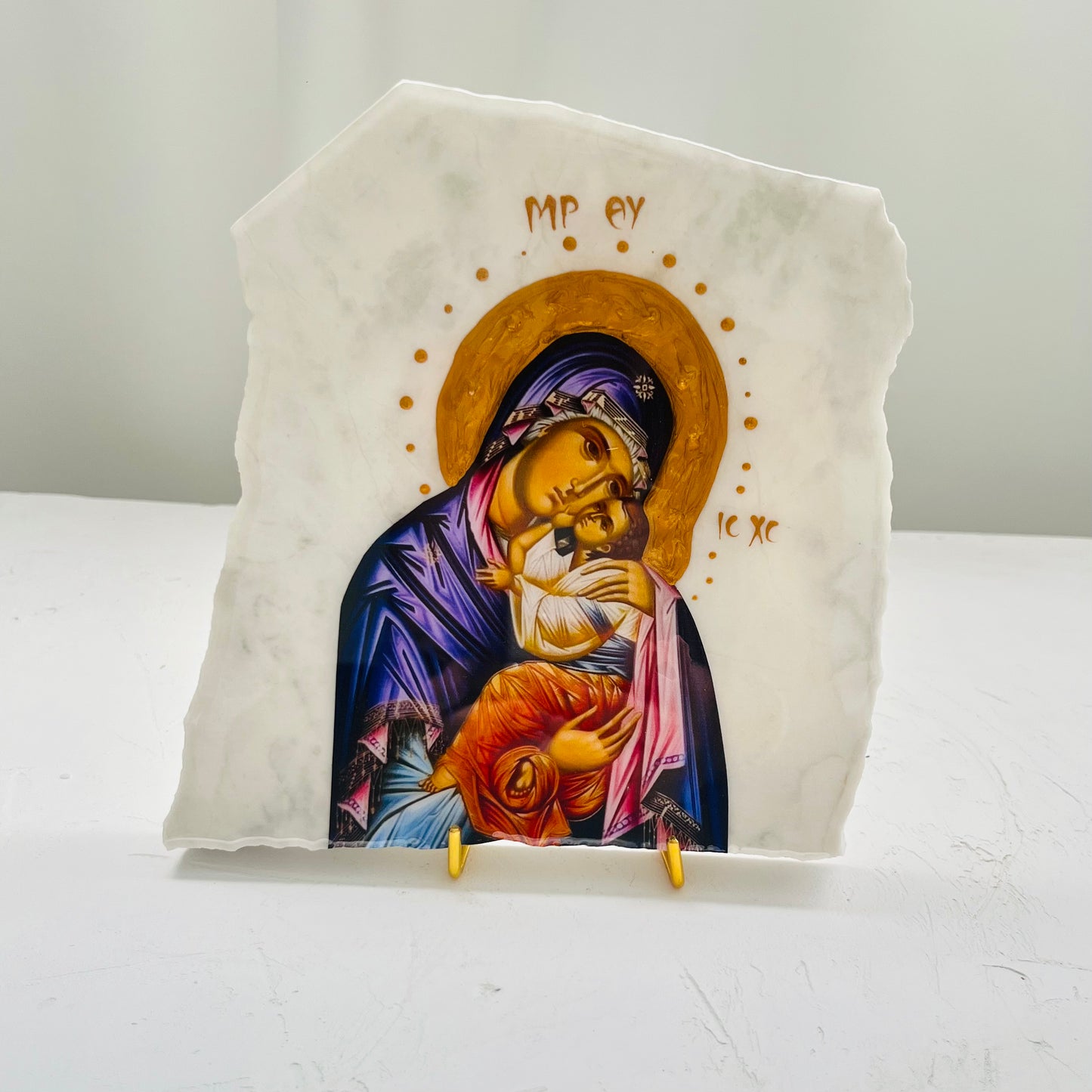 Panayia / Mary-Mother of Jesus icon is carefully handcrafted on Carrara Marble covered with a clear hypoxy resin.  Comes with a gold stand.