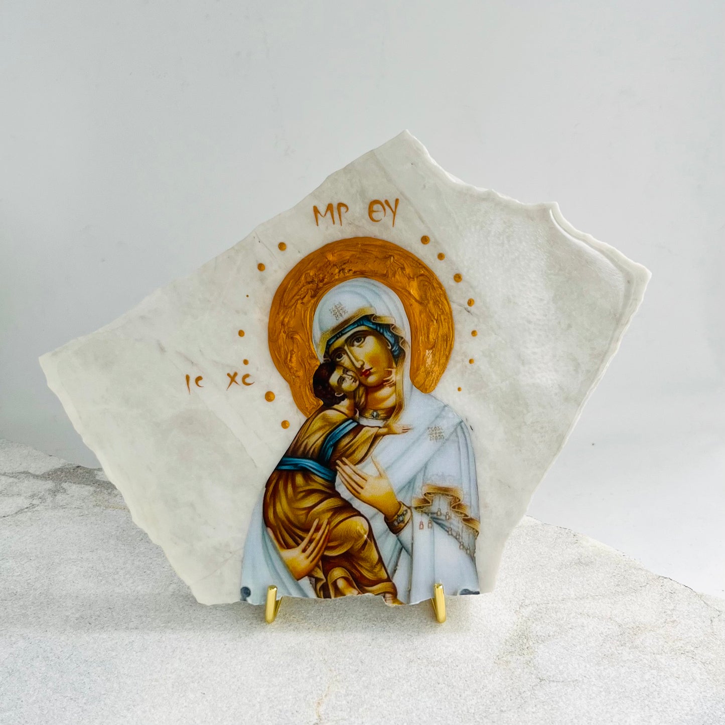 Mary-Mother of Jesus / Panaiya icon is carefully handcrafted on Carrara Marble covered with a clear hypoxy resin.  Comes with a gold stand.