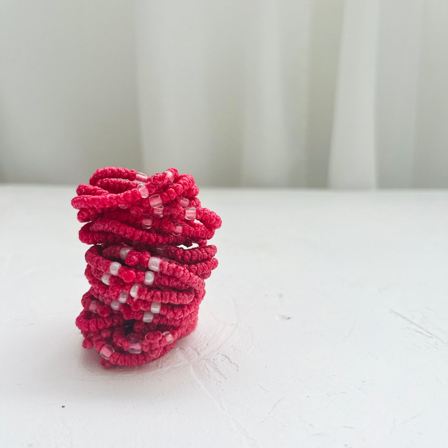 The Hot Pink Komboskini is a traditional Orthodox prayer rope, handwoven with knots—each tied with a prayer. It serves as a spiritual tool for focus, humility, and inner peace. Whether worn on the wrist or held in the hand, the komboskini is a constant reminder of faith and the presence of God.
