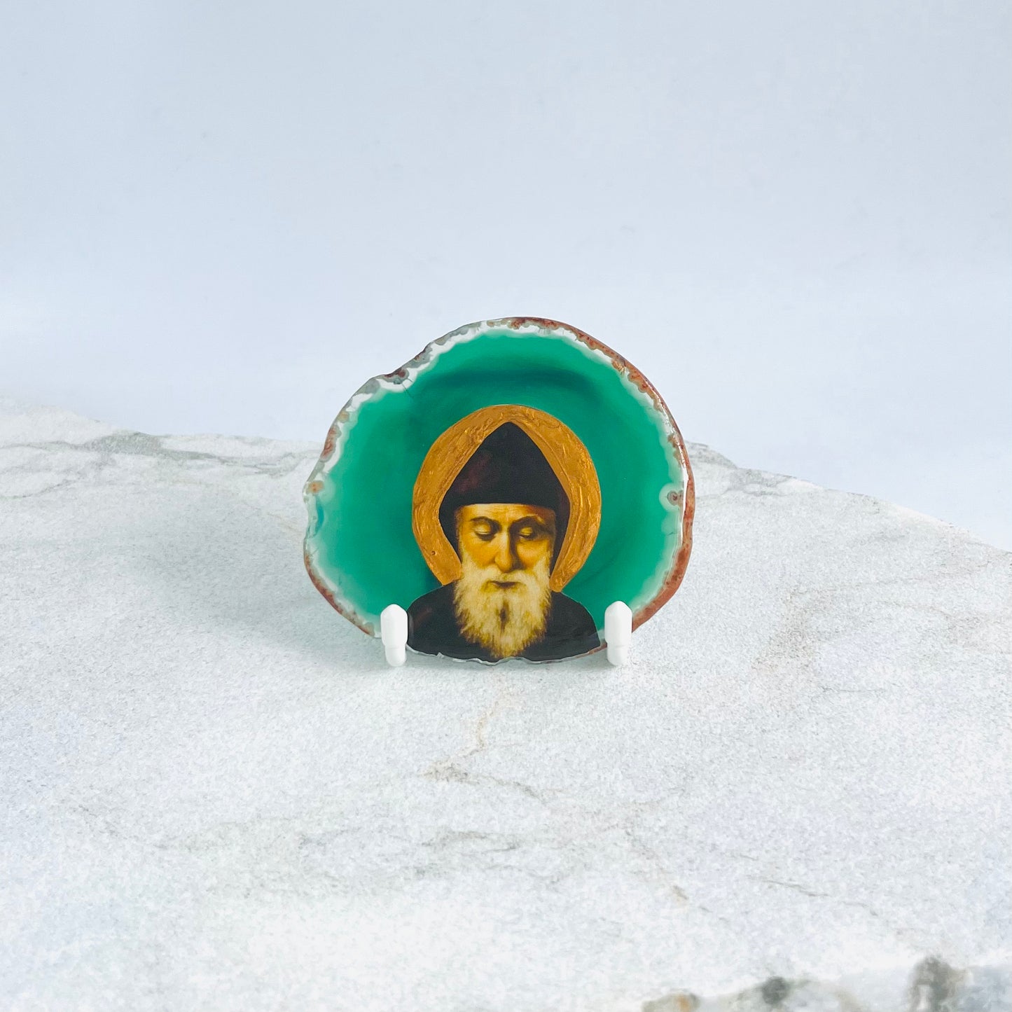 Saint Charbel Maronite Icon is carefully handcrafted on Brazilian Crystal Agate, covered with a clear hypoxy resin.