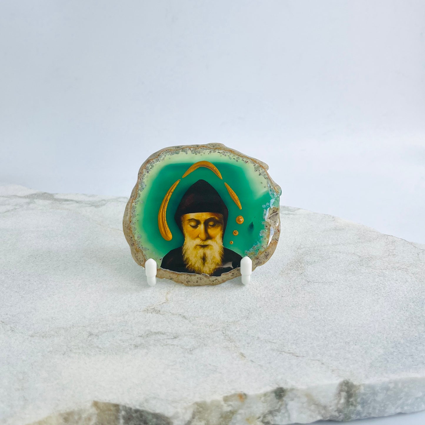 Saint Charbel Maronite Icon is carefully handcrafted on Brazilian Crystal Agate, covered with a clear hypoxy resin.