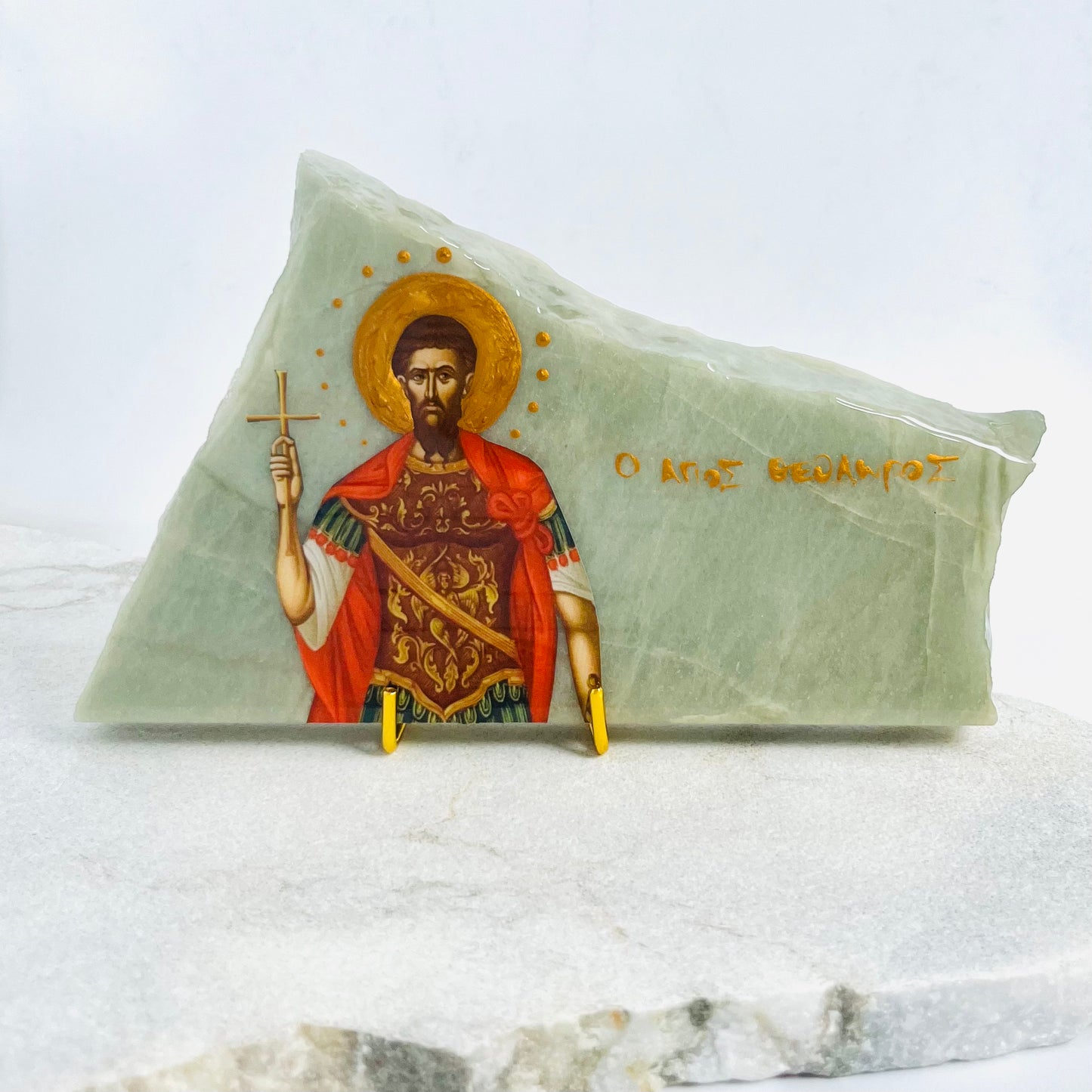 Agios Theodoros Greek Orthodox Icon is carefully handcrafted on Esmerelda Quartzite covered with a clear hypoxy resin.