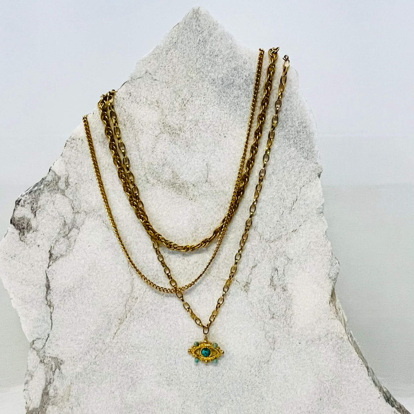 Evil Eye Three Chain Necklace made of 18k gold-plated steel with Turquoise stones.