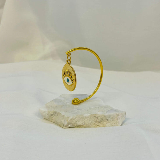 Evil Eye Gold Amulet Plated on White Marble – My Christening Box (Side View)